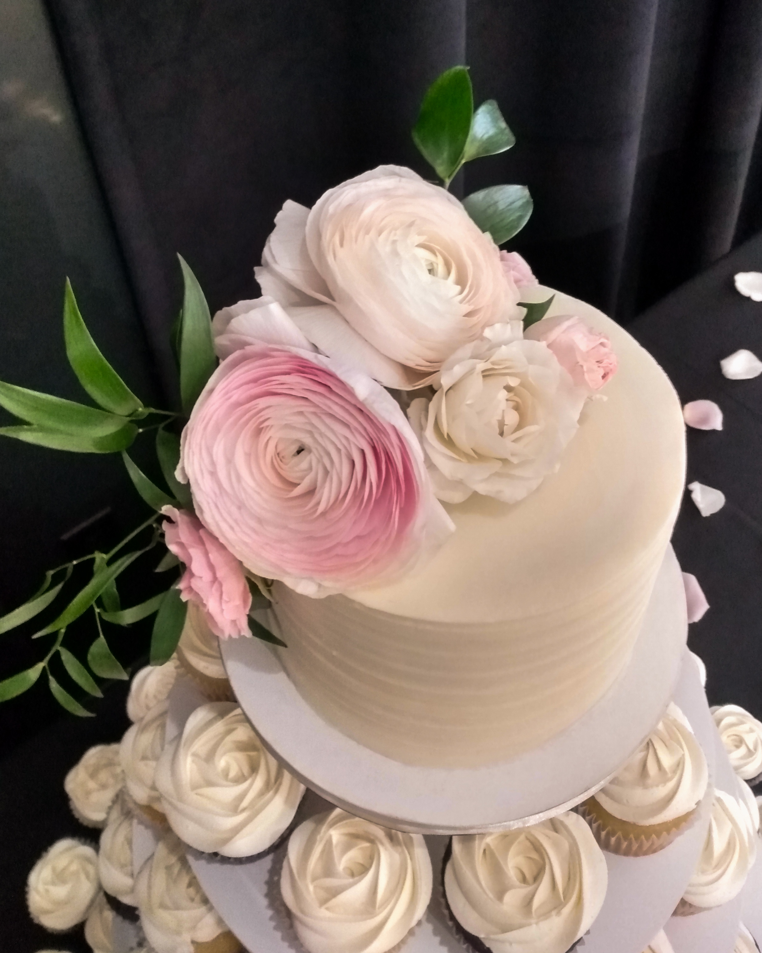 mini cutting cake with pink ranunculus and white roses