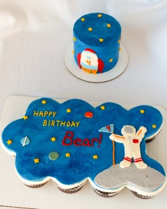 4" smash cake with 12 ct cupcake cake in a space theme