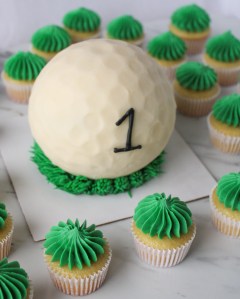 4" 3D golf ball cake with mini cupcakes